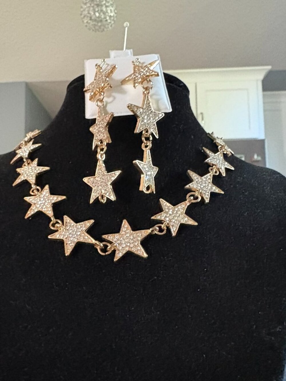 Gold rhinestone star necklace and pierced earrings